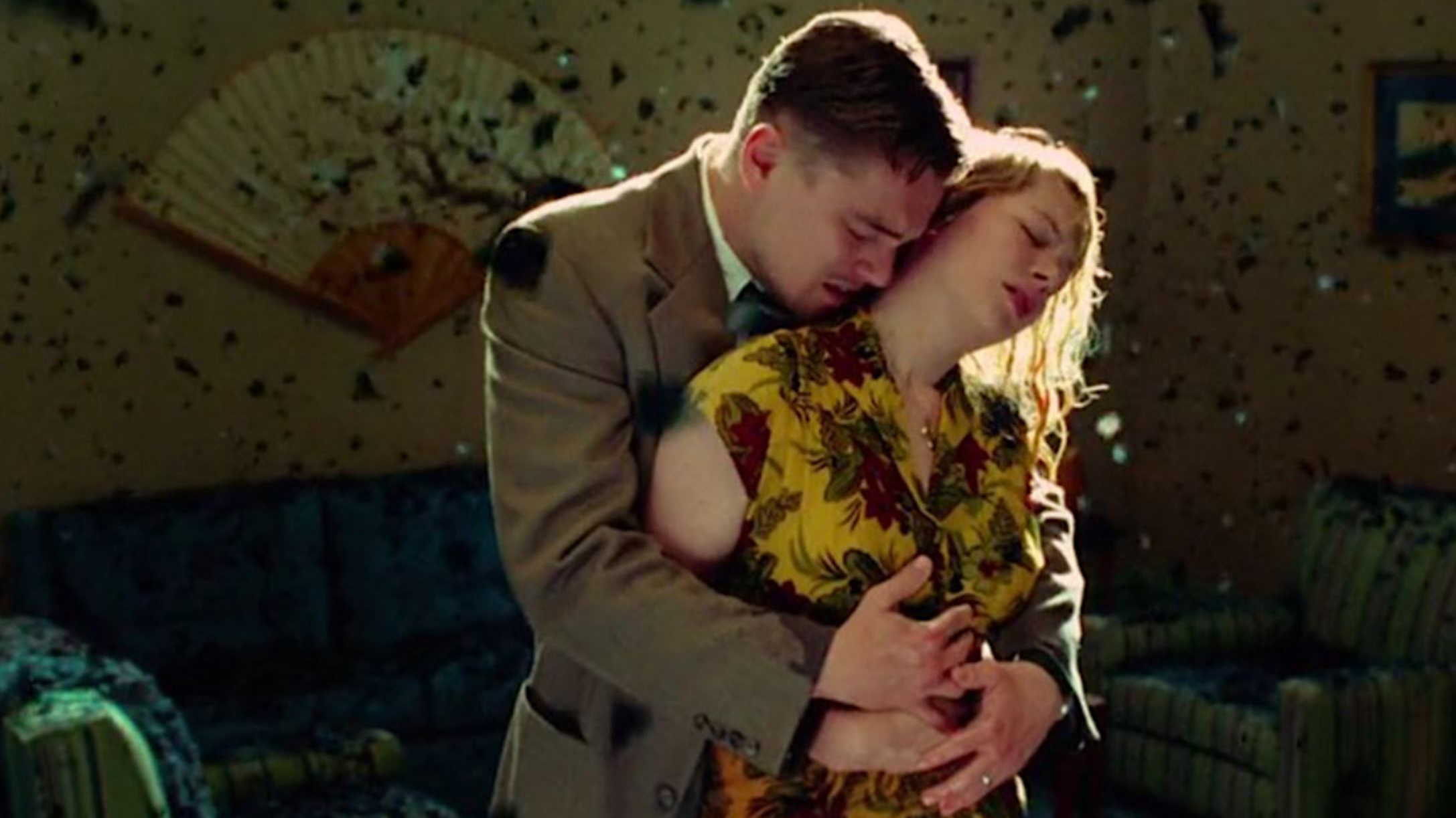 A still from the movie Shutter Island in which Leonardo DiCaprio's character Teddy hugs Michelle Williams' character, Dolores.